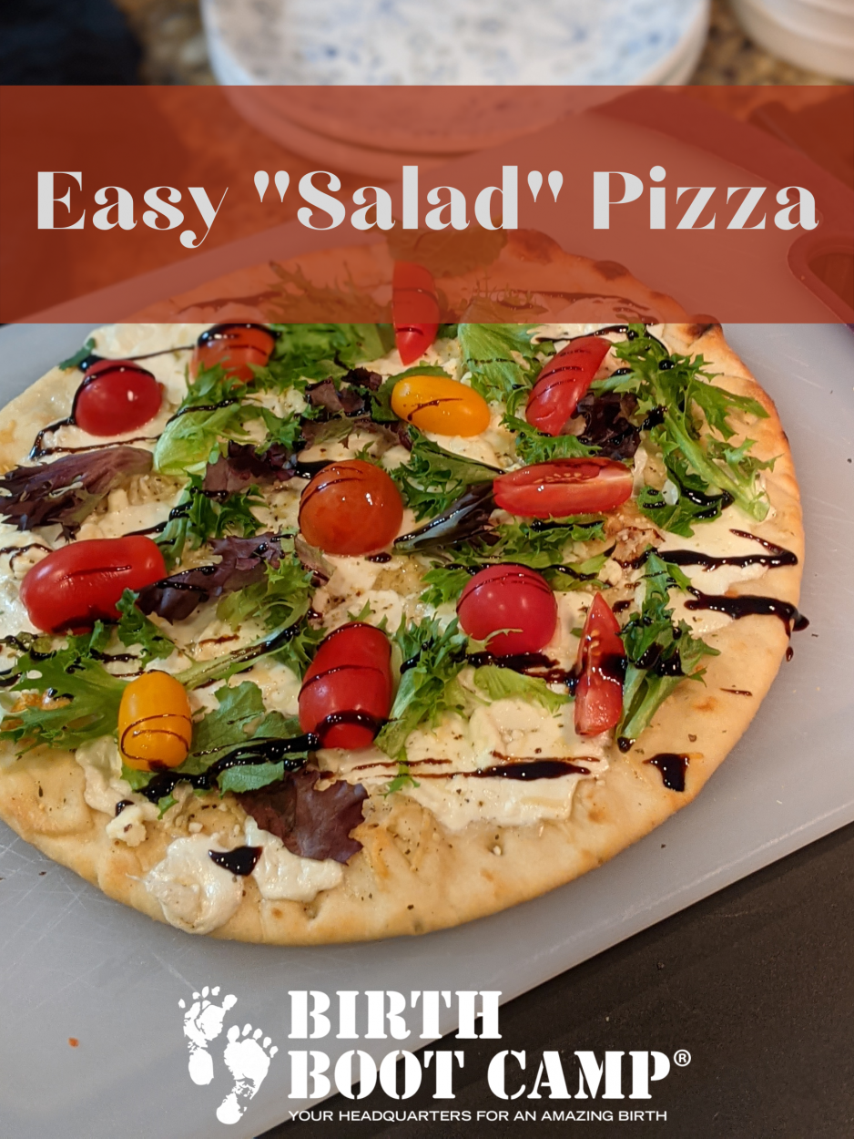 Naan bread pizza with spring mix, tomatoes, and balsamic on top