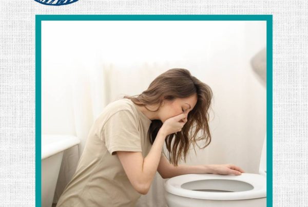 Text: 6 tips to lessen morning sickness symptoms. Image: pregnant women in bathroom leaning over toilet bowl.